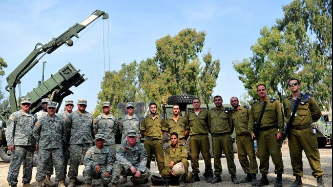 US and Israeli soldiers pose for a photo during a military drill held in 2012